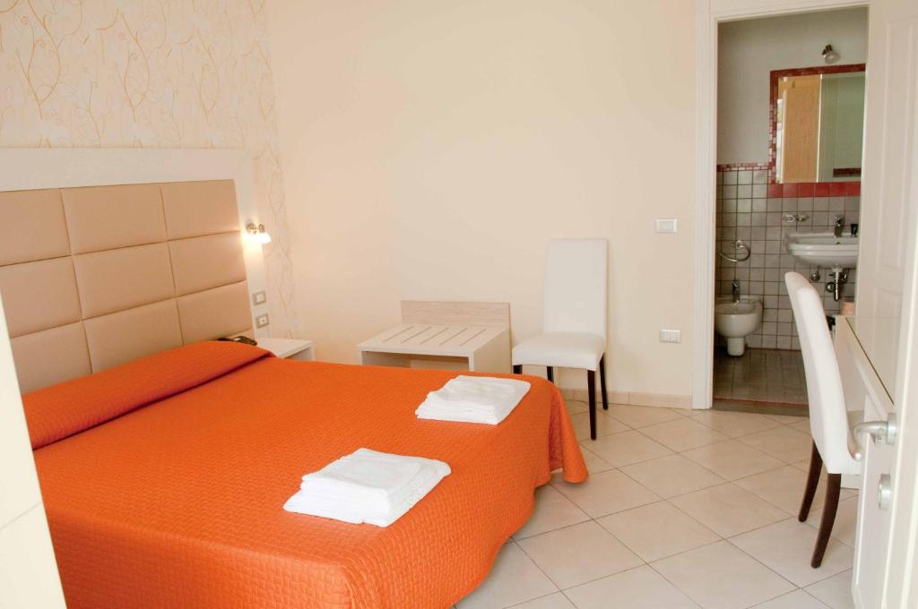 Posteľ alebo postele v izbe v ubytovaní Villa Vittoria Tropea B&B