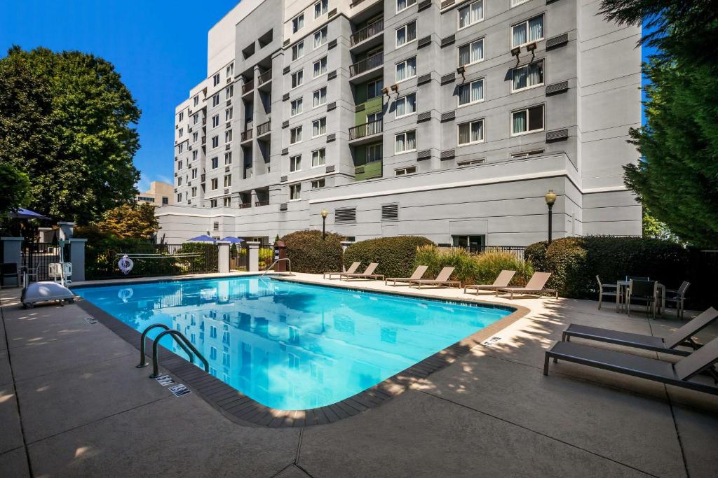 a large swimming pool in front of a building at Sonesta Select Atlanta Midtown Georgia Tech in Atlanta