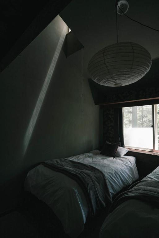 Postel nebo postele na pokoji v ubytování Mountain Hut Myoko