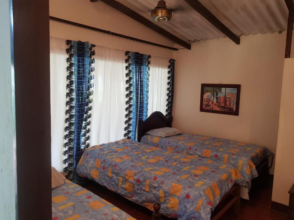 Postel nebo postele na pokoji v ubytování Cabaña en la playa Punta Bolivar