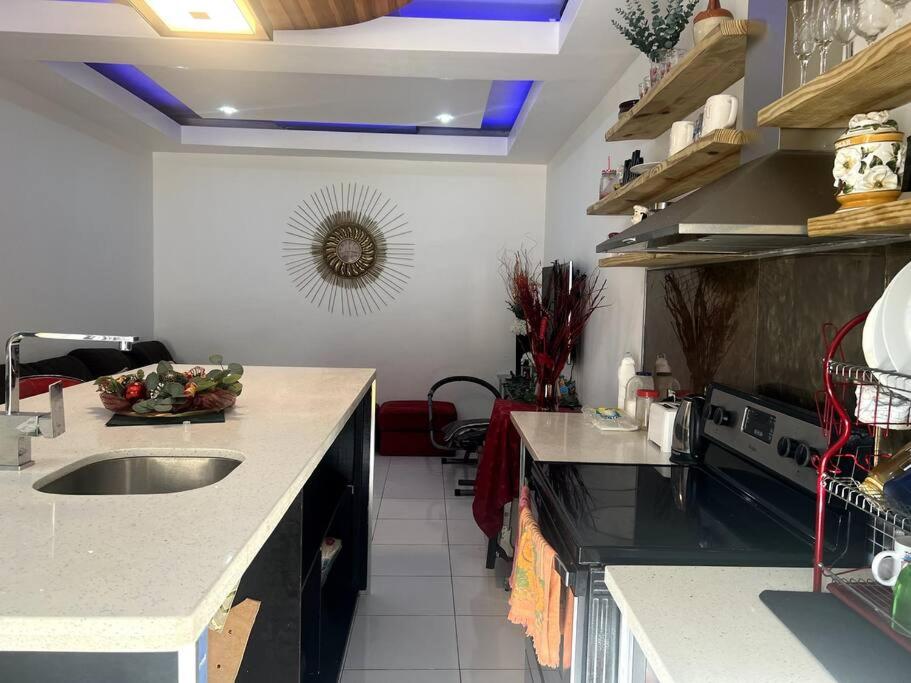 a kitchen with a sink and a counter top at Cozy One-Bedroom Retreat in Maverty