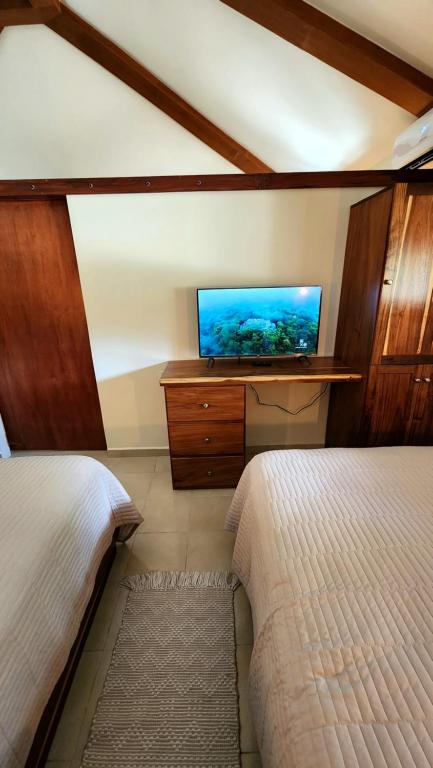 Postel nebo postele na pokoji v ubytování Hotel Cabañas Aldea Maya
