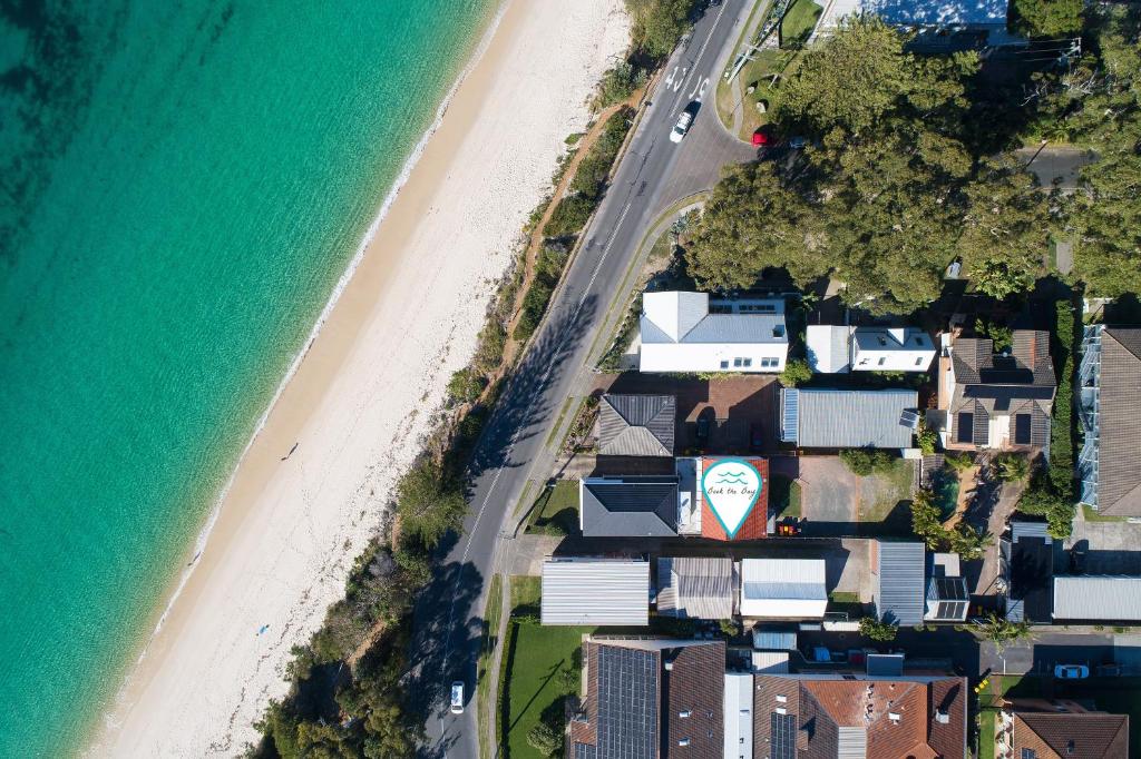an aerial view of a beach with houses and the ocean at Moana Blue in Shoal Bay