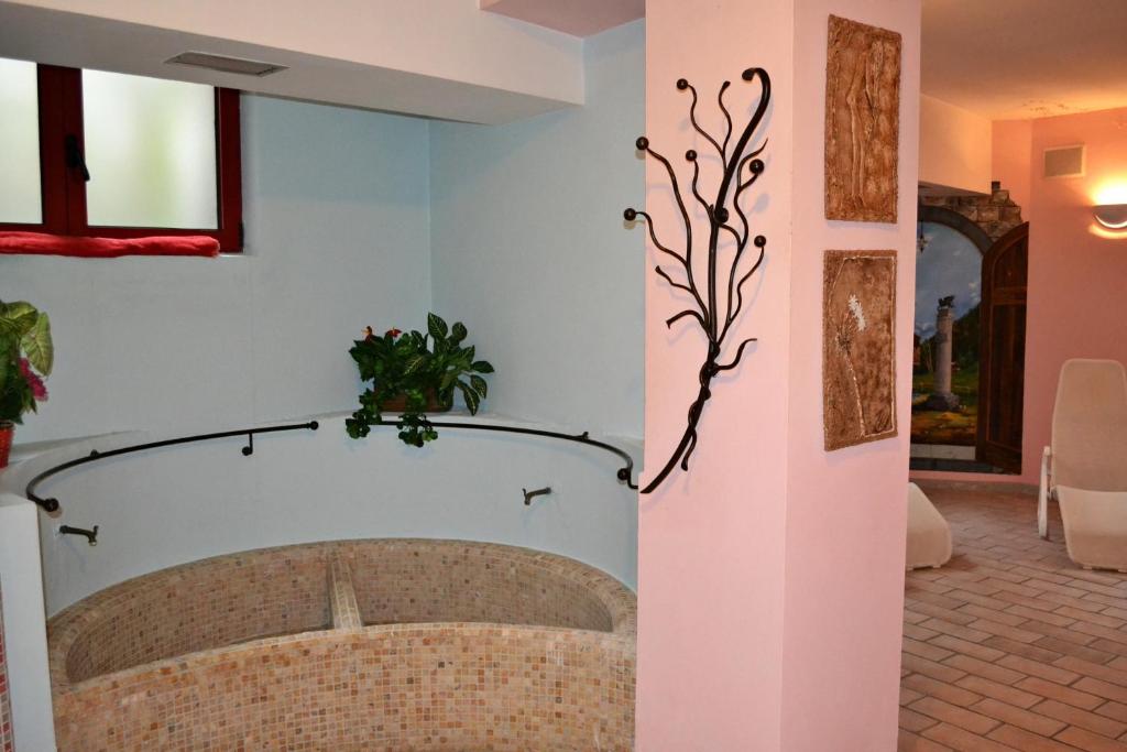 Postel nebo postele na pokoji v ubytování Hotel La Montanina