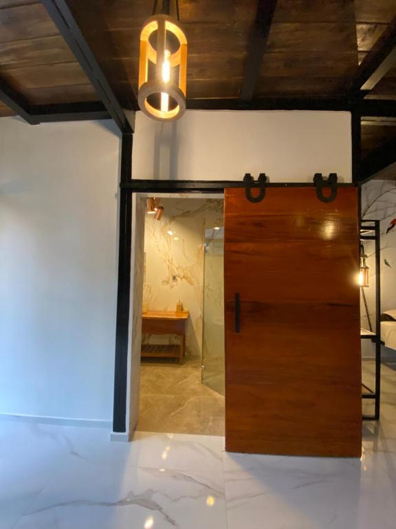 Postel nebo postele na pokoji v ubytování Suites Casa ColibrÍ