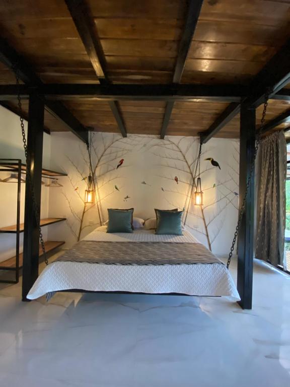 Postel nebo postele na pokoji v ubytování Suites Casa ColibrÍ