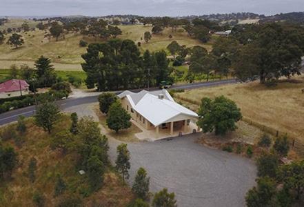an aerial view of a house with a white roof at Lambert Estate Retreat in Angaston