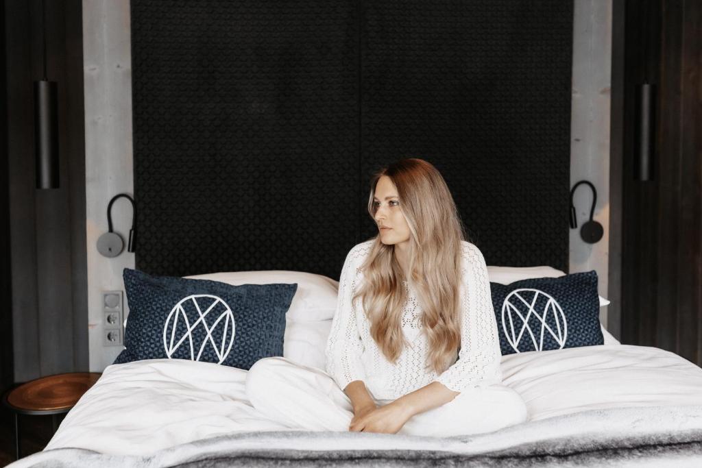 Postel nebo postele na pokoji v ubytování ONKL XONNA Premium Alpin Chalets