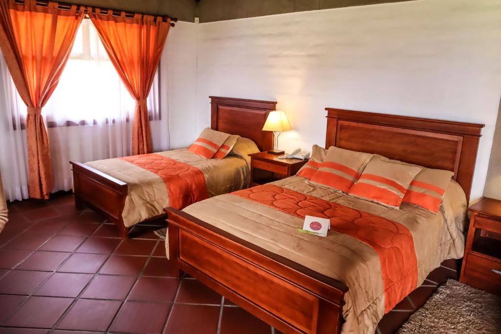 Postel nebo postele na pokoji v ubytování Hostería San Clemente