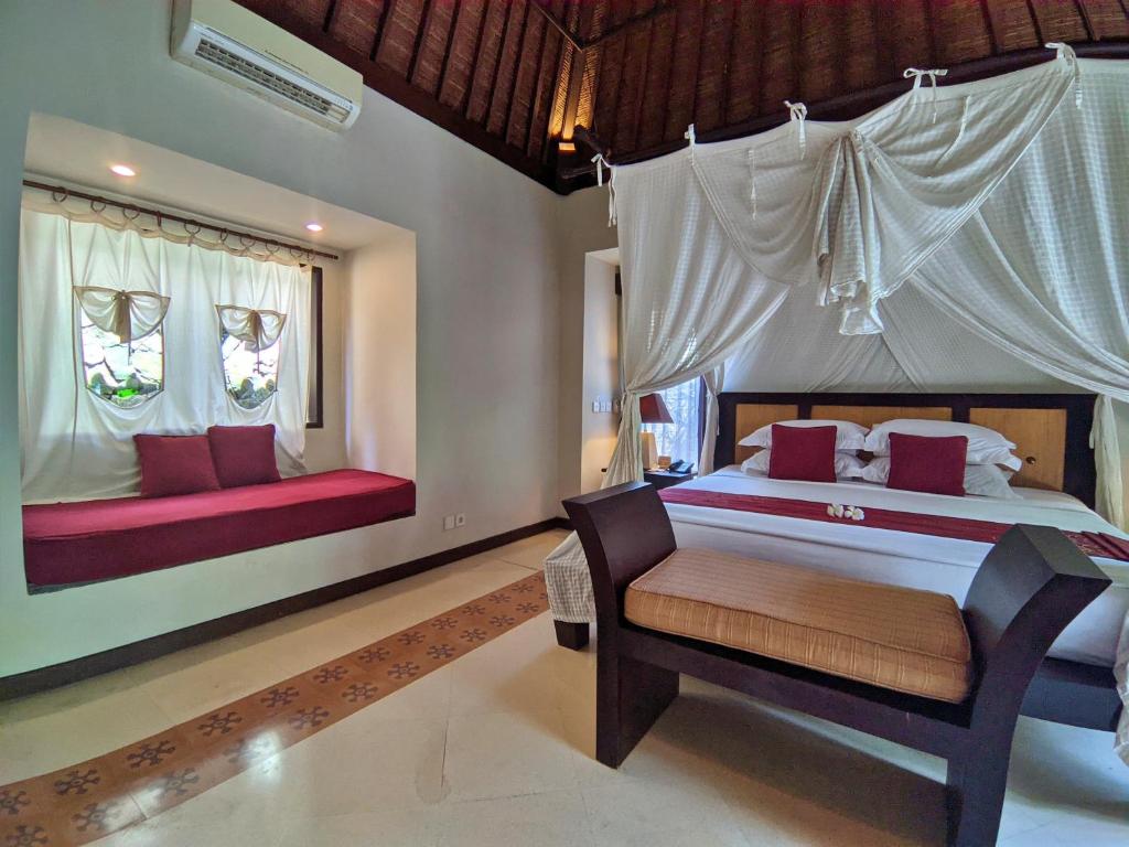 Postel nebo postele na pokoji v ubytování Barong Resort Ubud by Puri Signatures