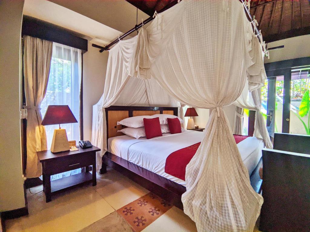 Postel nebo postele na pokoji v ubytování Barong Resort Ubud by Puri Signatures