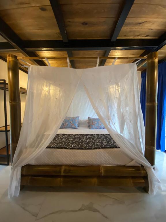 Postel nebo postele na pokoji v ubytování Suites Casa ColibrÍ