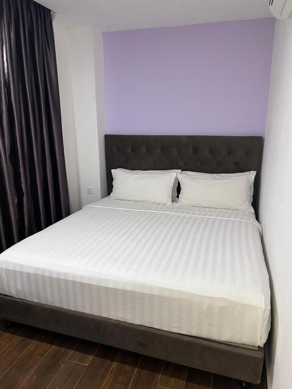 Postel nebo postele na pokoji v ubytování Elmark Hotel Johor