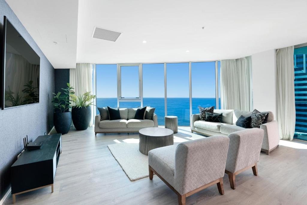 a living room with a view of the ocean at Hilton Five Star Panoramic Oceanview Sub-Penthouse in Gold Coast
