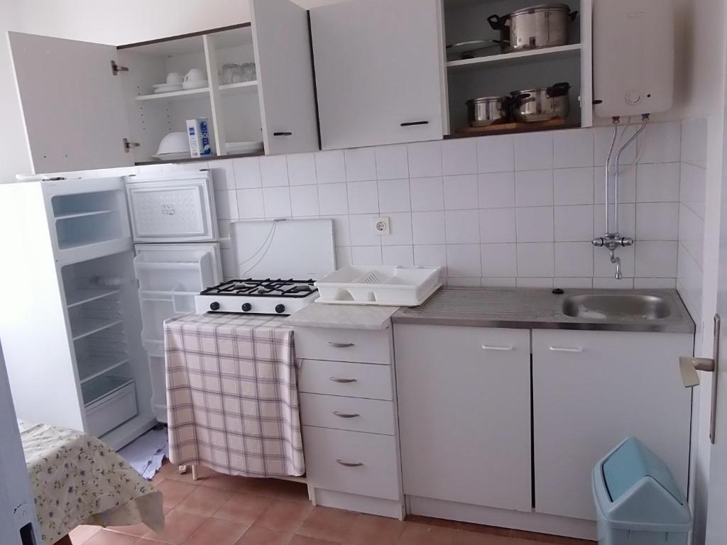 Kuchyň nebo kuchyňský kout v ubytování Apartments 031