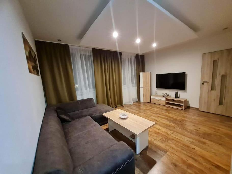 a living room with a couch and a table at apartman MI in Michalovce