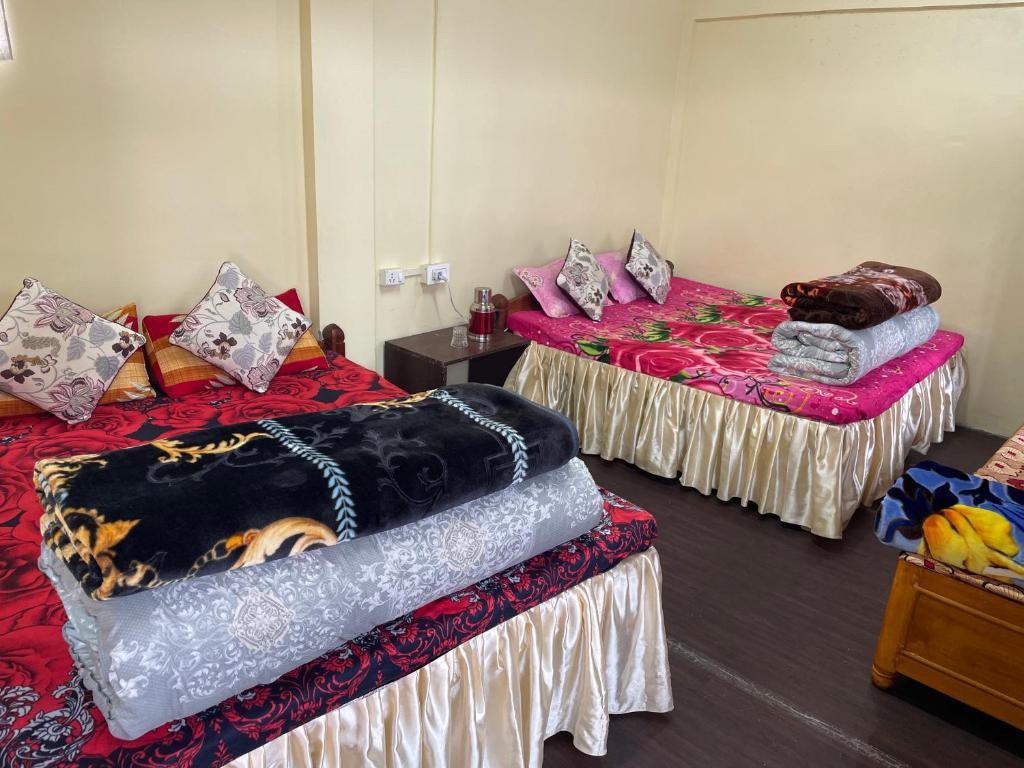 Postel nebo postele na pokoji v ubytování Jasmine Homestay Darjeeling