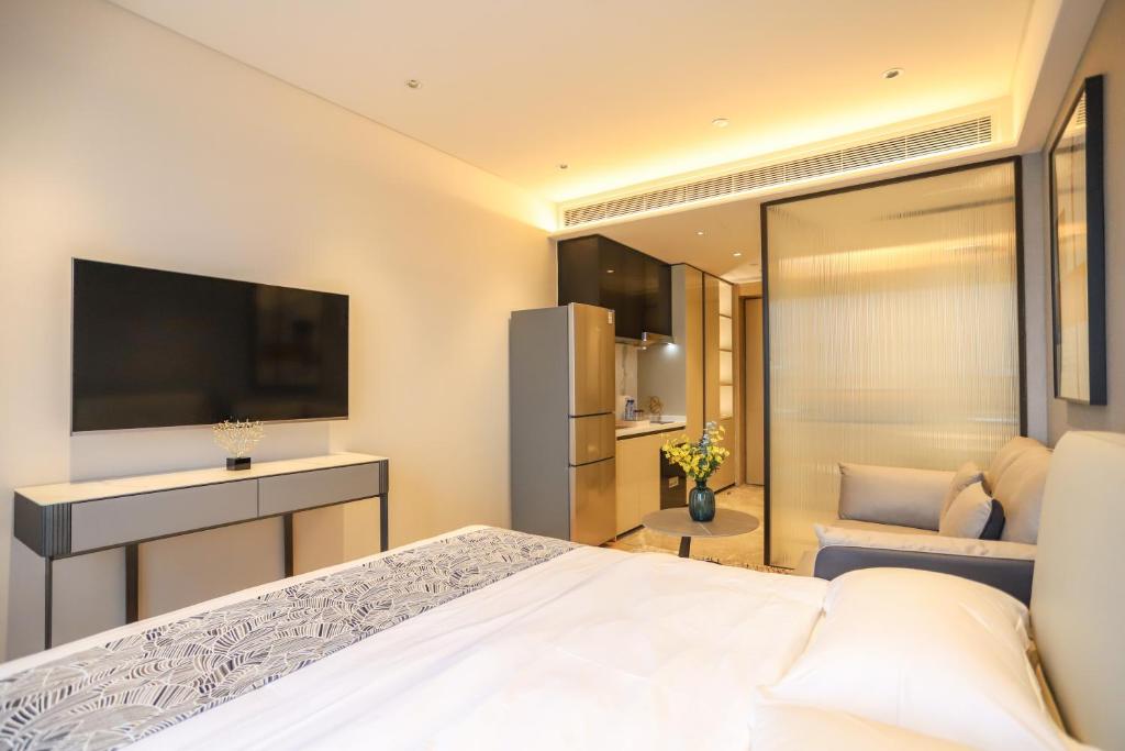 TV a/nebo společenská místnost v ubytování Canopy Executive Apartments - Shenzhen Futian Center