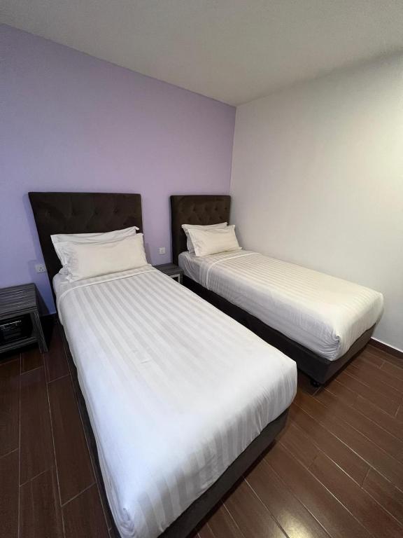 Postel nebo postele na pokoji v ubytování Elmark Hotel Johor