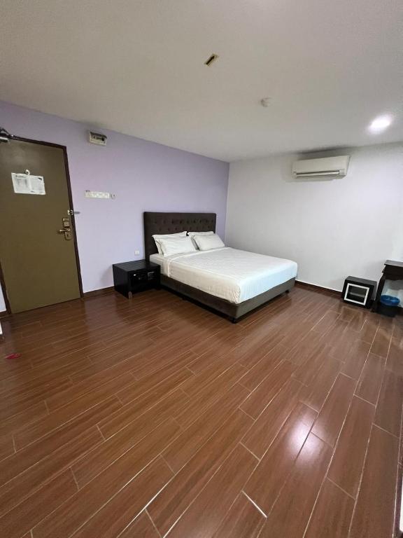 Postel nebo postele na pokoji v ubytování Elmark Hotel Johor