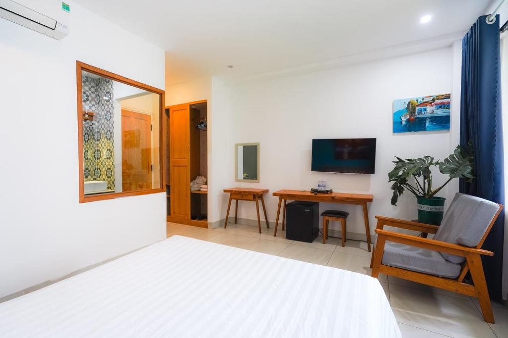 TV a/nebo společenská místnost v ubytování Cavilla Boutique Hotel & Apartment Da Nang