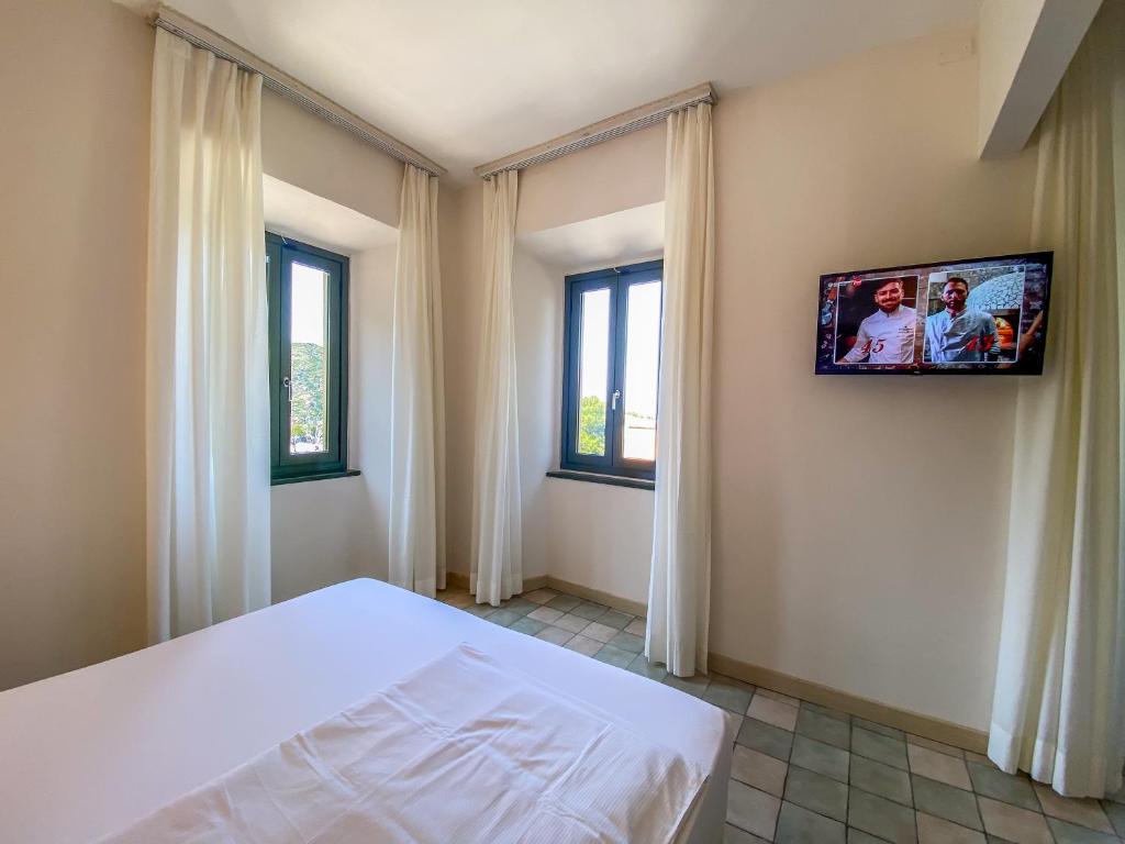 TV a/nebo společenská místnost v ubytování La Mandola eco Hostel