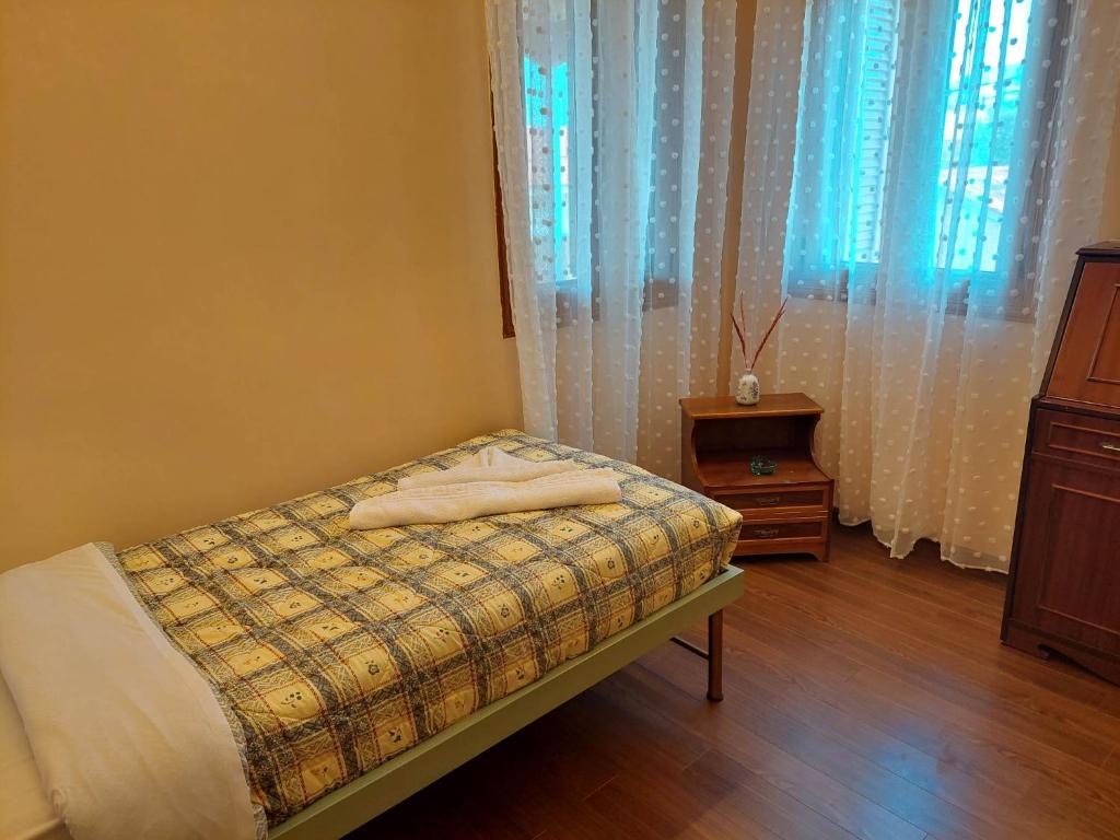 Postel nebo postele na pokoji v ubytování Kalypso Home F