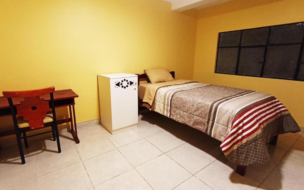 Postel nebo postele na pokoji v ubytování Casa Sucre Hostel Ayacucho
