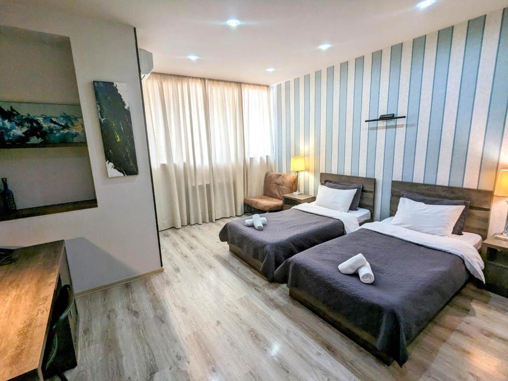Postel nebo postele na pokoji v ubytování Sani Hotel