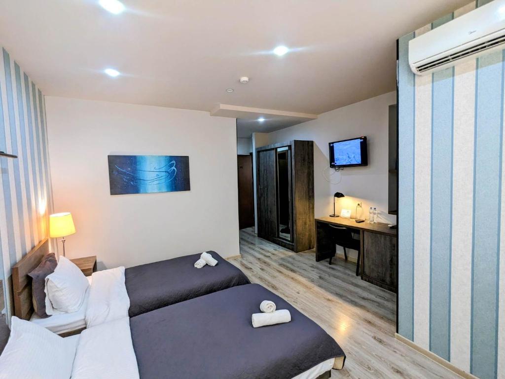 TV a/nebo společenská místnost v ubytování Sani Hotel
