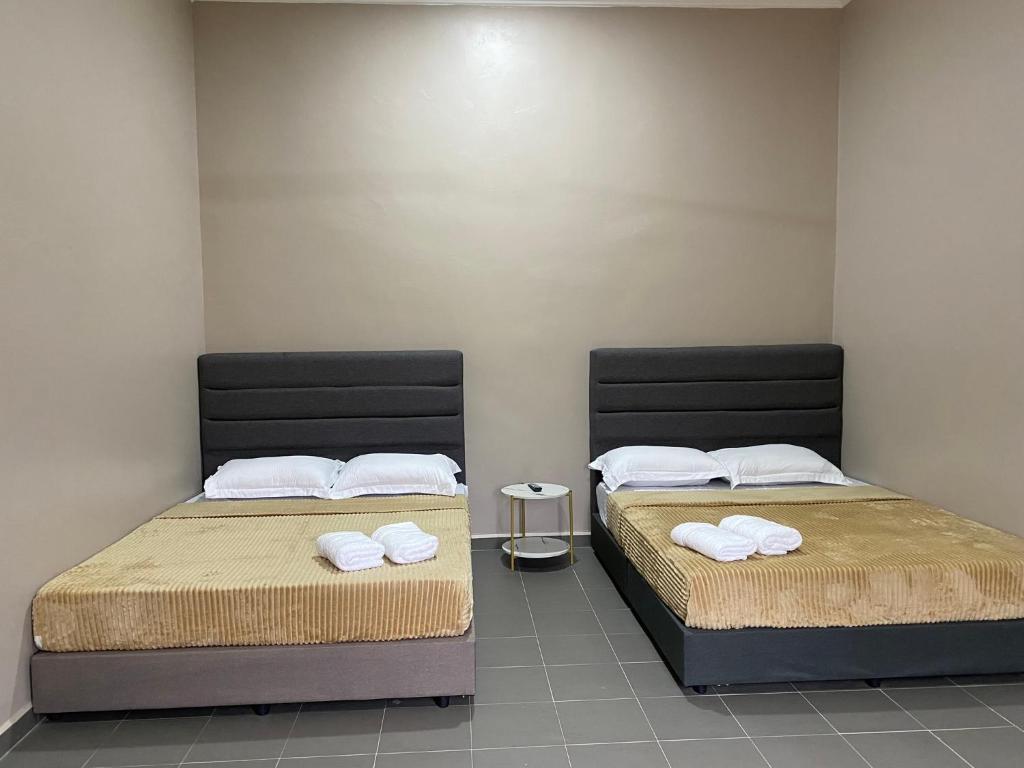 Postel nebo postele na pokoji v ubytování Sasuka Guesthouse (Muslim Sahaja)