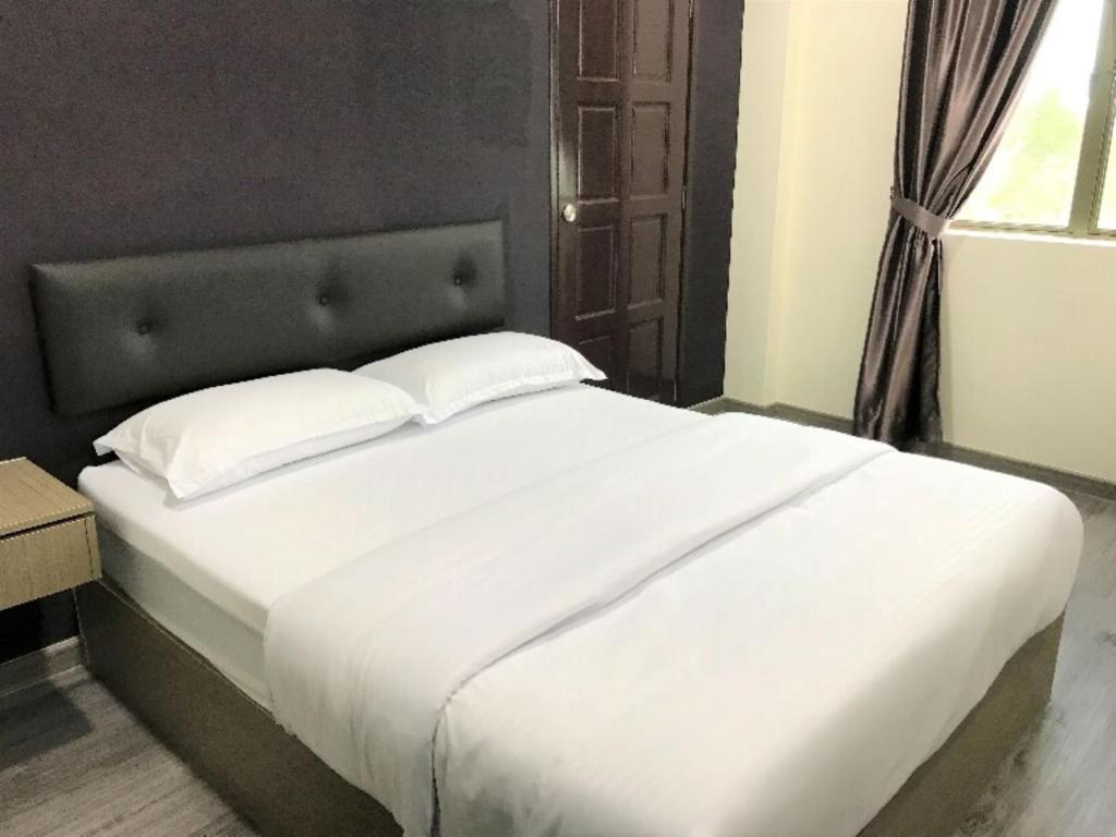 Postel nebo postele na pokoji v ubytování Z Stay Inn Hotel