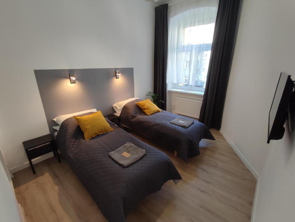 Posteľ alebo postele v izbe v ubytovaní Apartament Rybaki 22