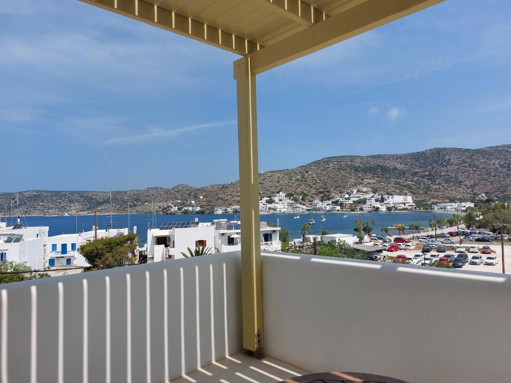 a balcony with a view of a harbor at Diasino Apartments and Car Rental in Katapola