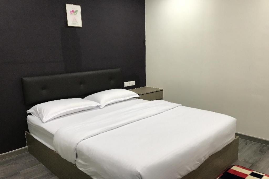 Postel nebo postele na pokoji v ubytování Z Stay Inn Hotel