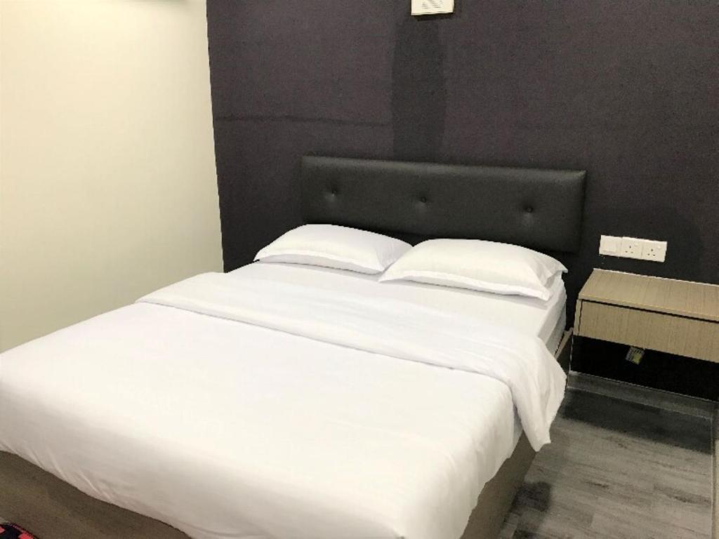 Postel nebo postele na pokoji v ubytování Z Stay Inn Hotel