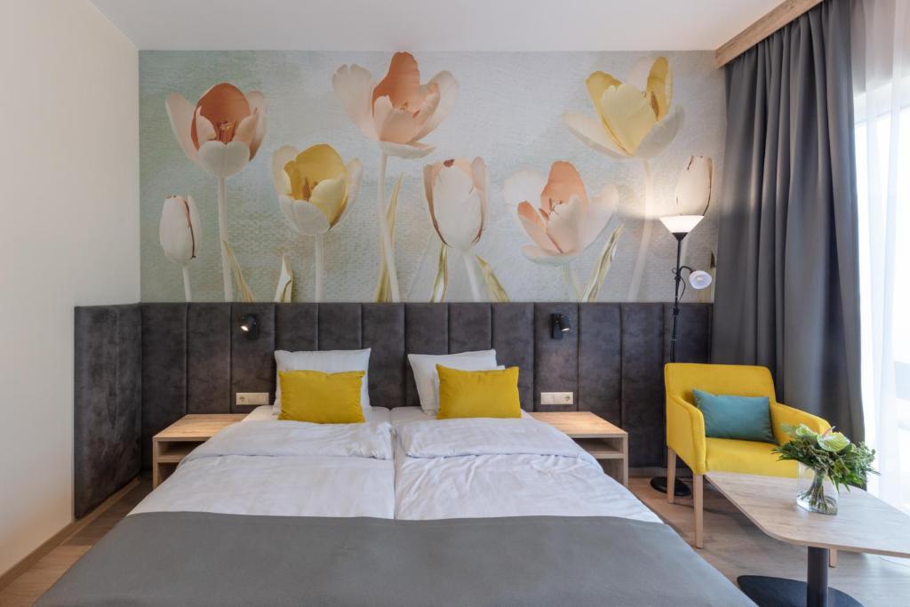 Postel nebo postele na pokoji v ubytování Szépia Bio and Art Hotel