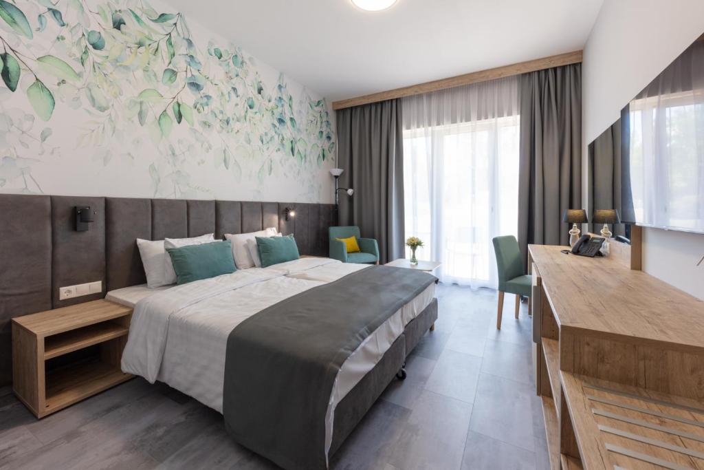 Postel nebo postele na pokoji v ubytování Szépia Bio and Art Hotel