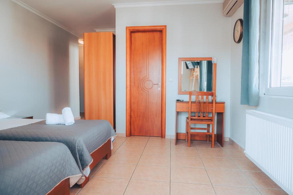 Postel nebo postele na pokoji v ubytování Dionysos Rooms