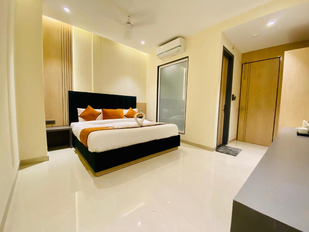 a bedroom with a large bed in a room at Hotel 51 in Amritsar
