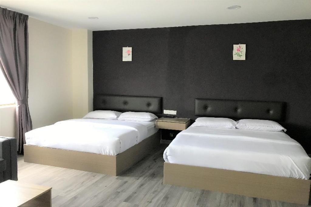 Postel nebo postele na pokoji v ubytování Z Stay Inn Hotel