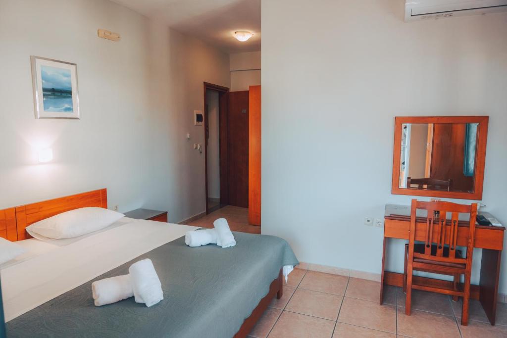Postel nebo postele na pokoji v ubytování Dionysos Rooms