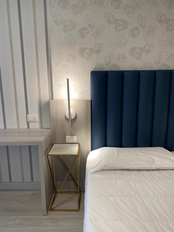 Postel nebo postele na pokoji v ubytování Hotel Liu