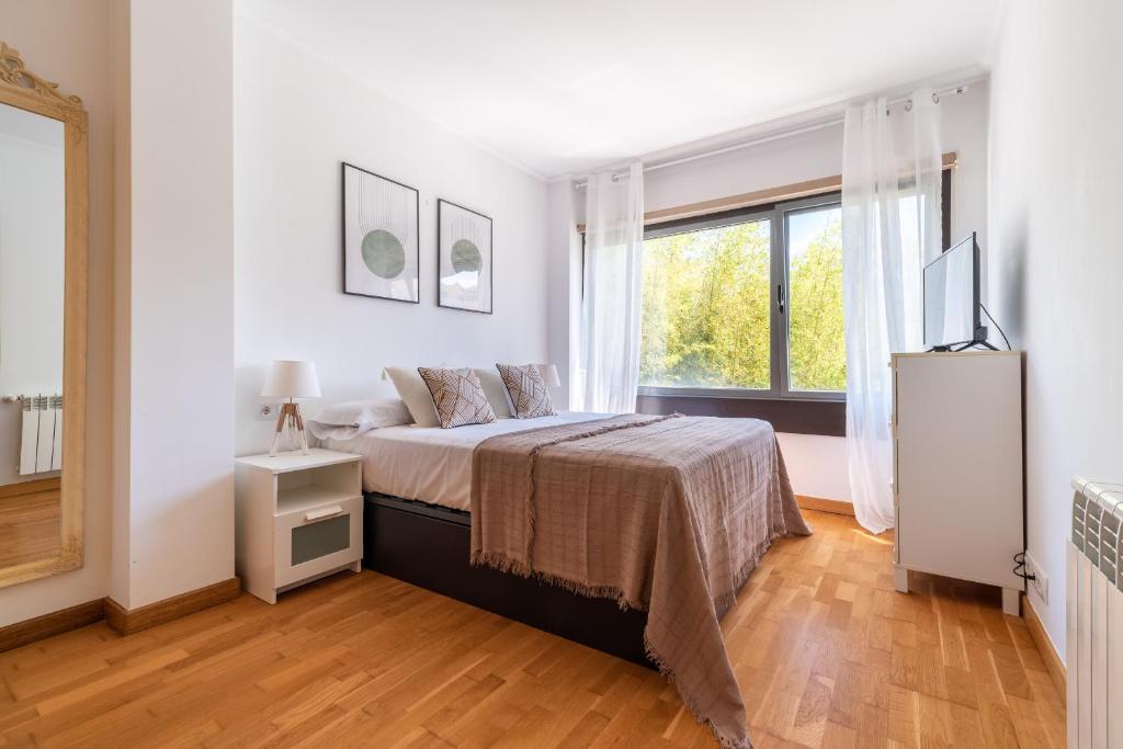 Ένα ή περισσότερα κρεβάτια σε δωμάτιο στο Apartamento Playa Bueu