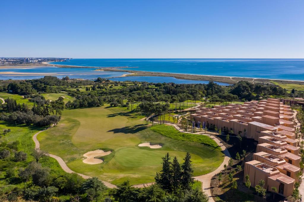 an aerial view of the golf course at the oceanfront resort at Palmares Signature Apartments in Lagos