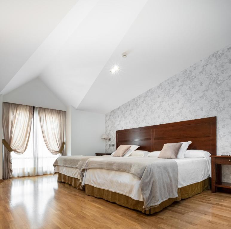 Postel nebo postele na pokoji v ubytování Hotel Villa Virginia