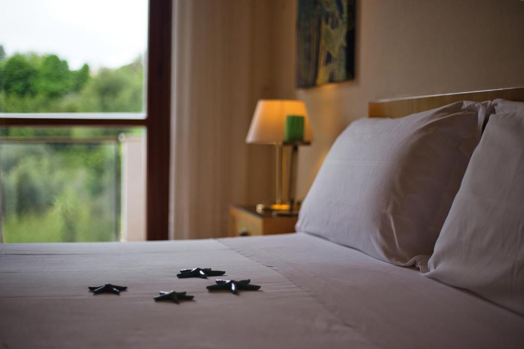 Postel nebo postele na pokoji v ubytování Hotel Sporting