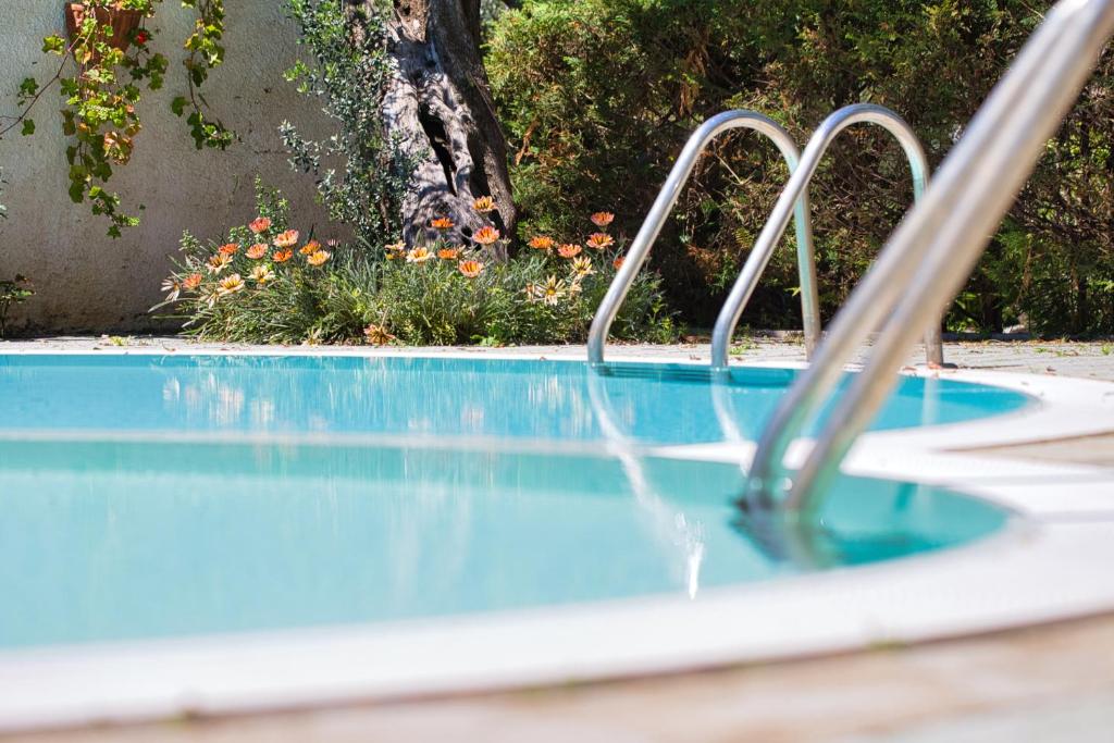 a swimming pool with a water slide in it at Hotel Sporting in Vasto