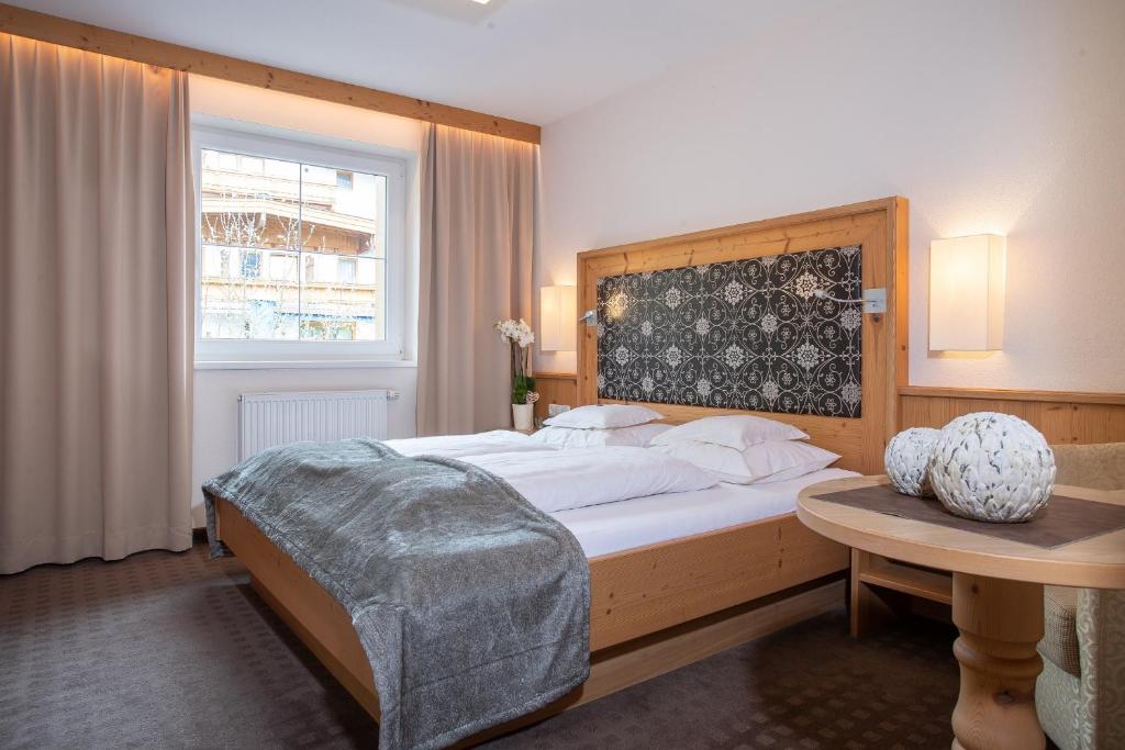 Postel nebo postele na pokoji v ubytování Alphaus Aparthotel