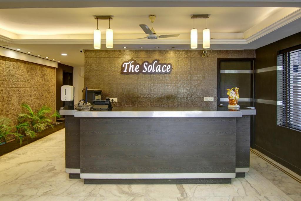 a restaurant with a counter with the sauce sign on the wall at The Solace in New Delhi